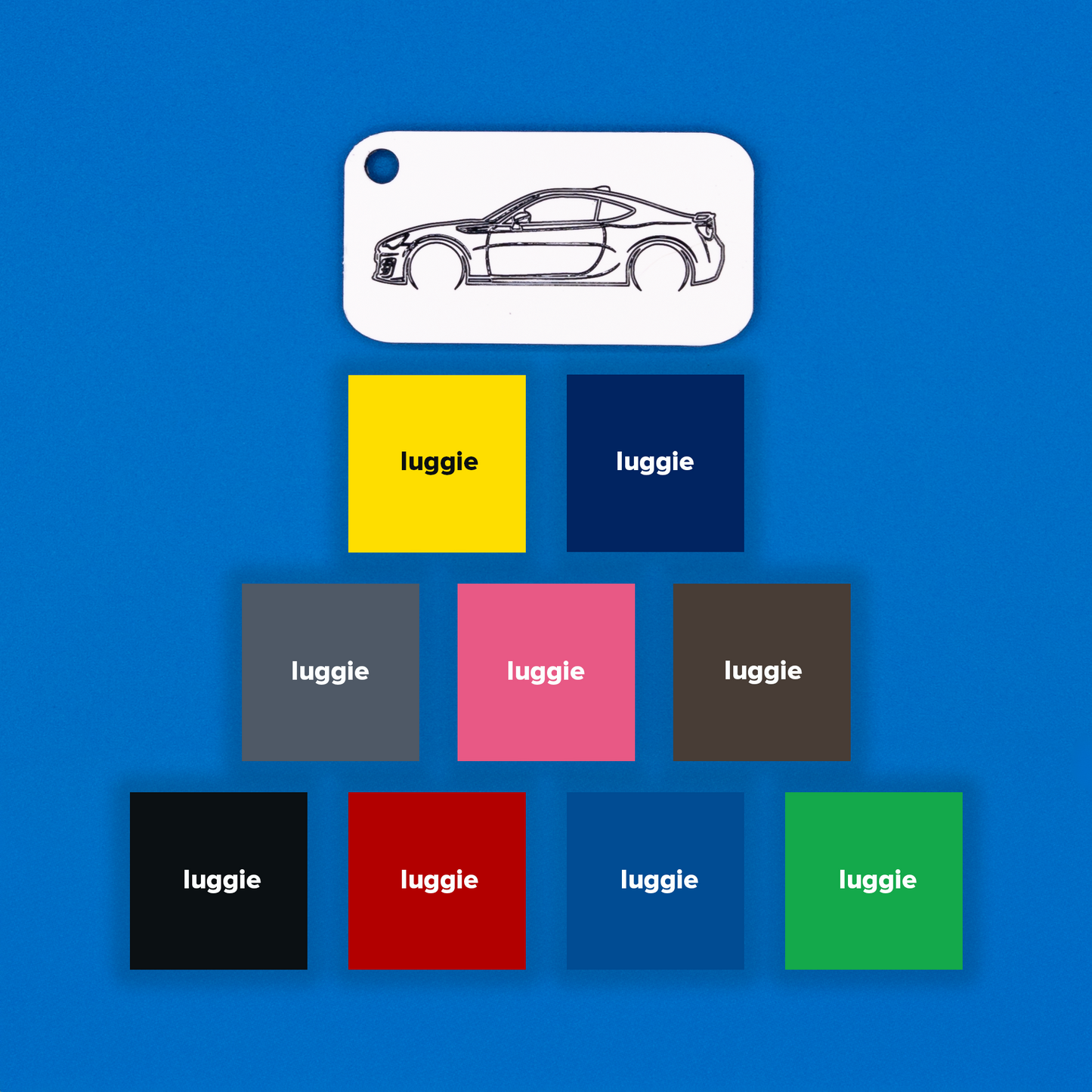 Toyota GT86 Acrylic Keychain in white with just the hole showcasing nine other color options: yellow, dark blue, grey, pink, chocolate, light blue, red, black and spring green.
