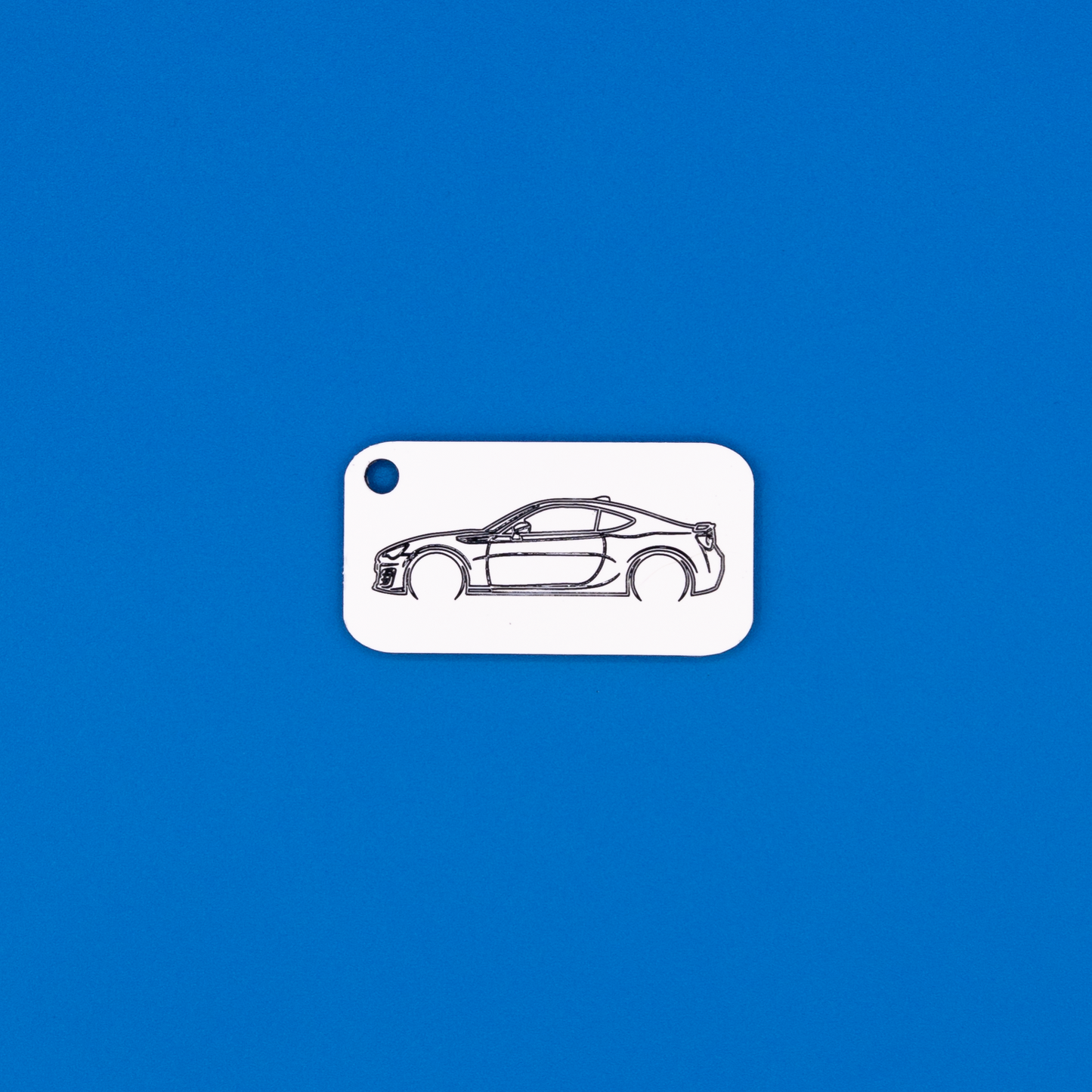 Toyota GT86 Acrylic Keychain in white with just the hole.