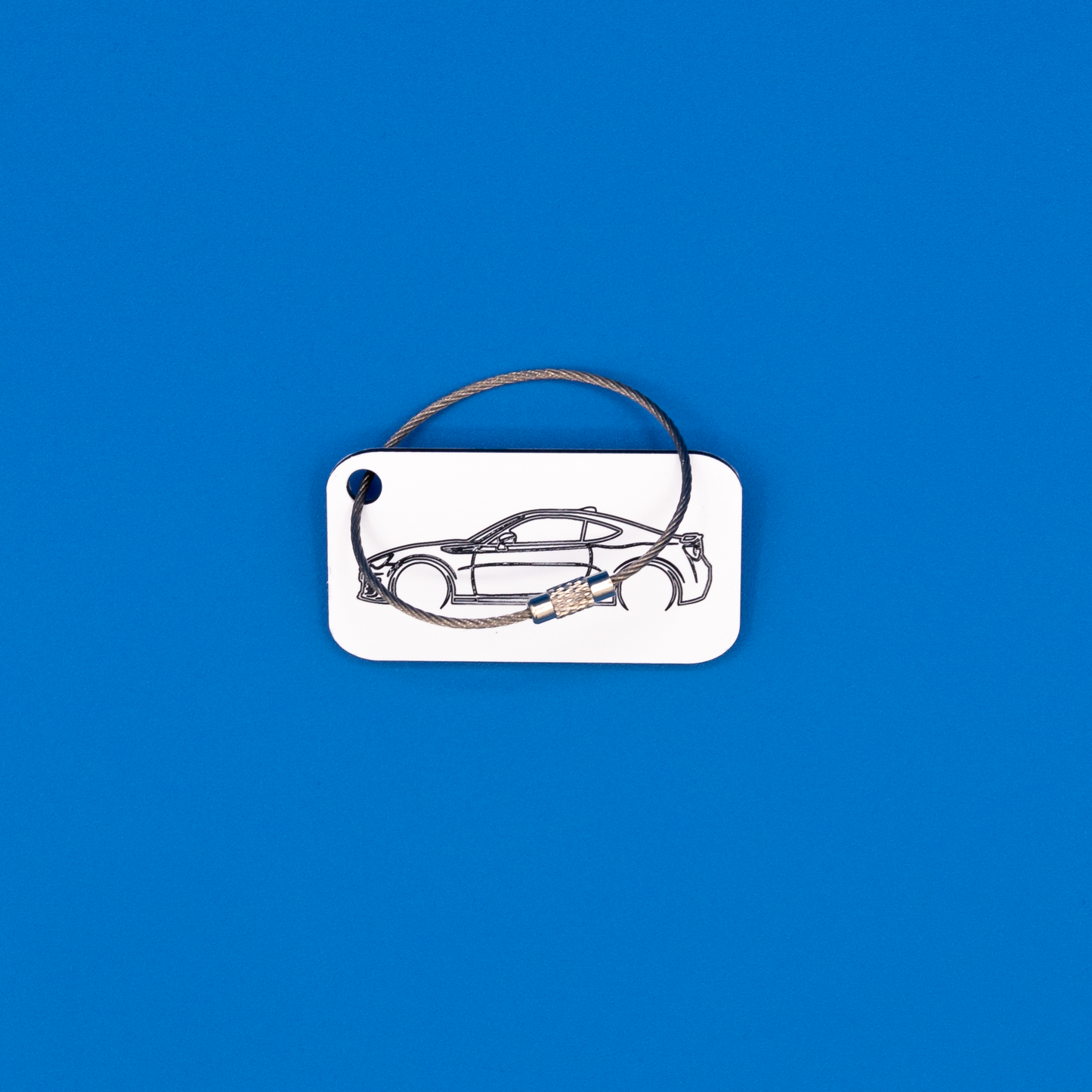 Toyota GT86 Acrylic Keychain in white with a wire loop.