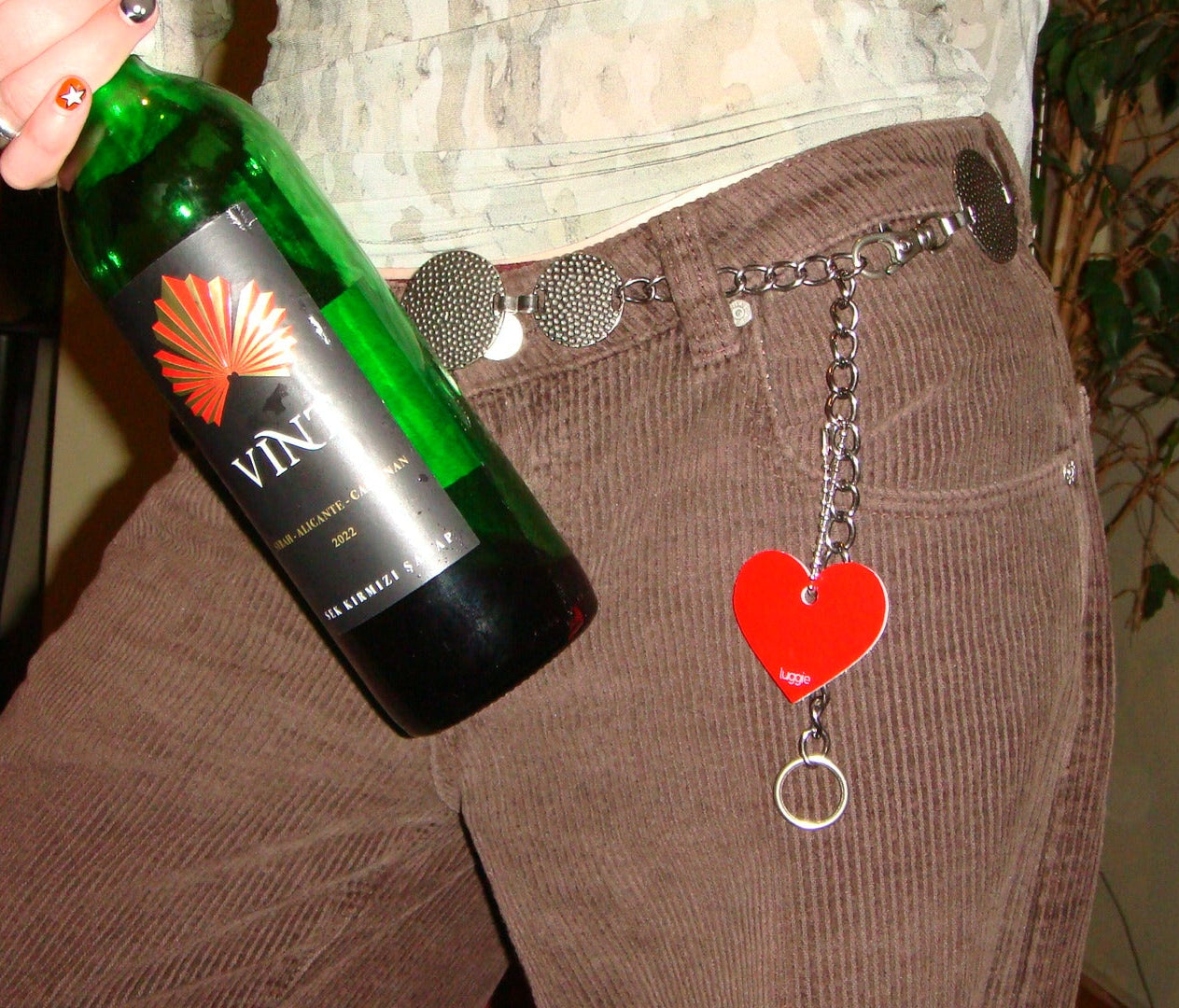 Picture of Heart Design Acrylic Keychain in red attached to chain on pants.