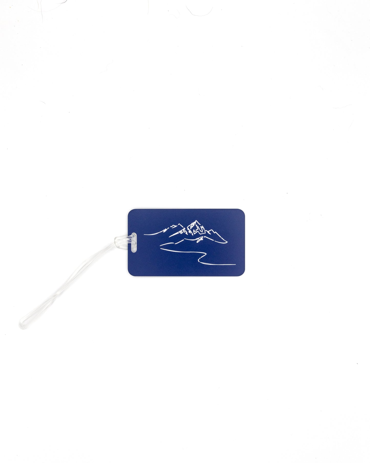 Mountain Design acrylic luggage tag in dark blue with worm loop.