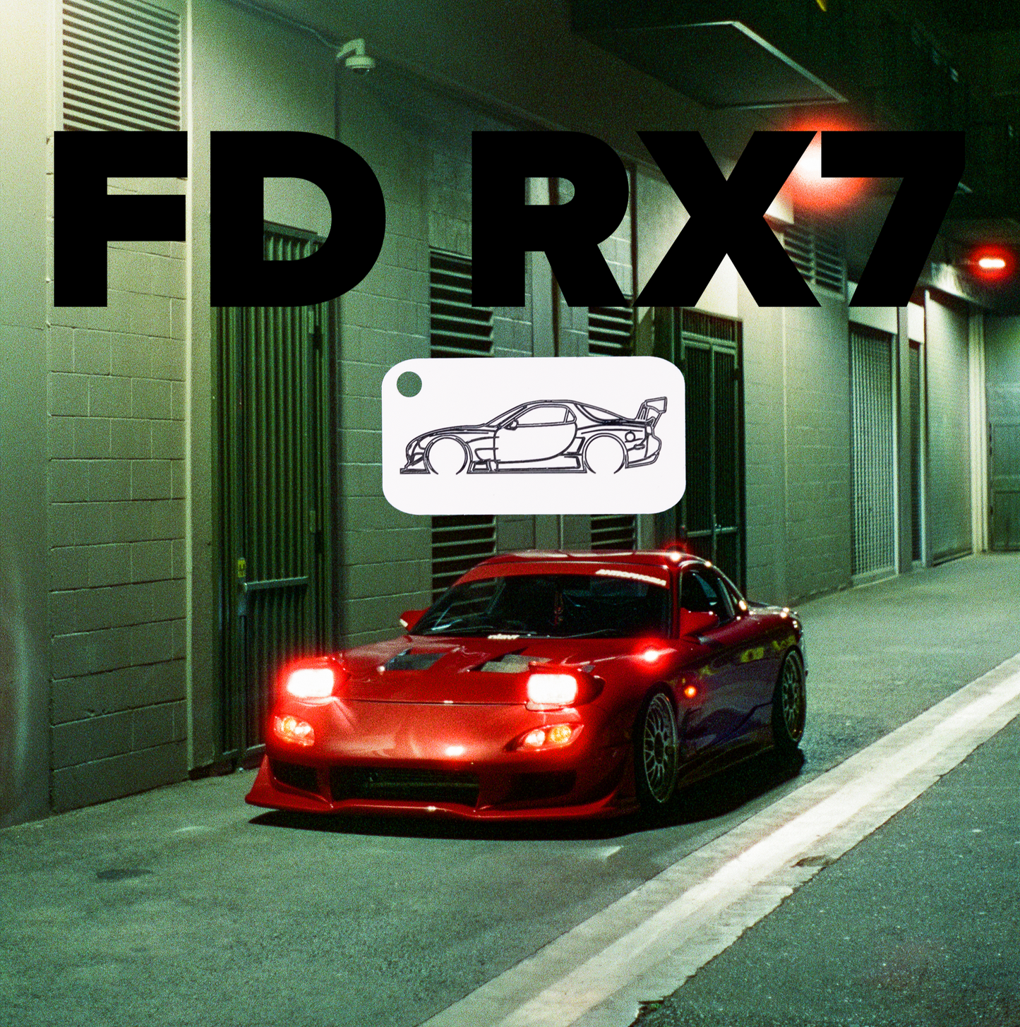 Mazda FD RX7 Acrylic Keychain in white in front of a red FD RX7 on film.