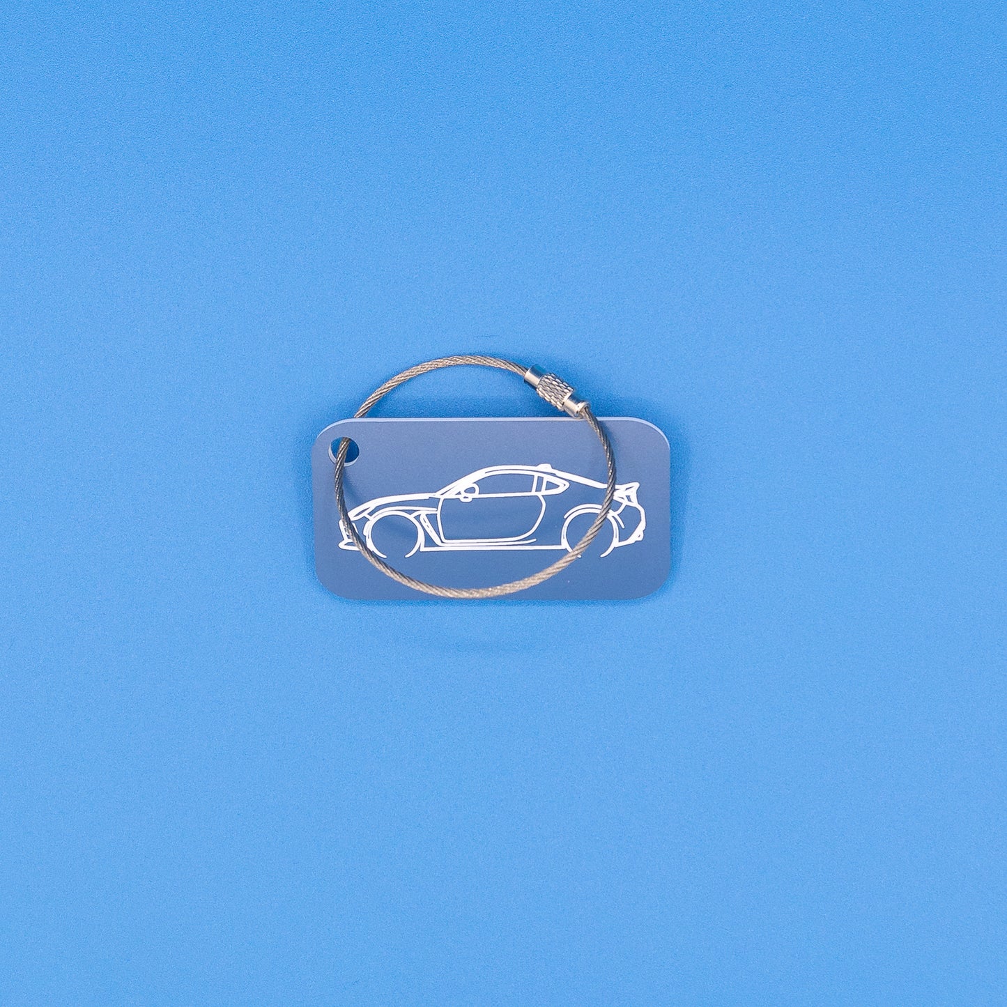 Toyota GR86 Keychain with wire loop on blue background