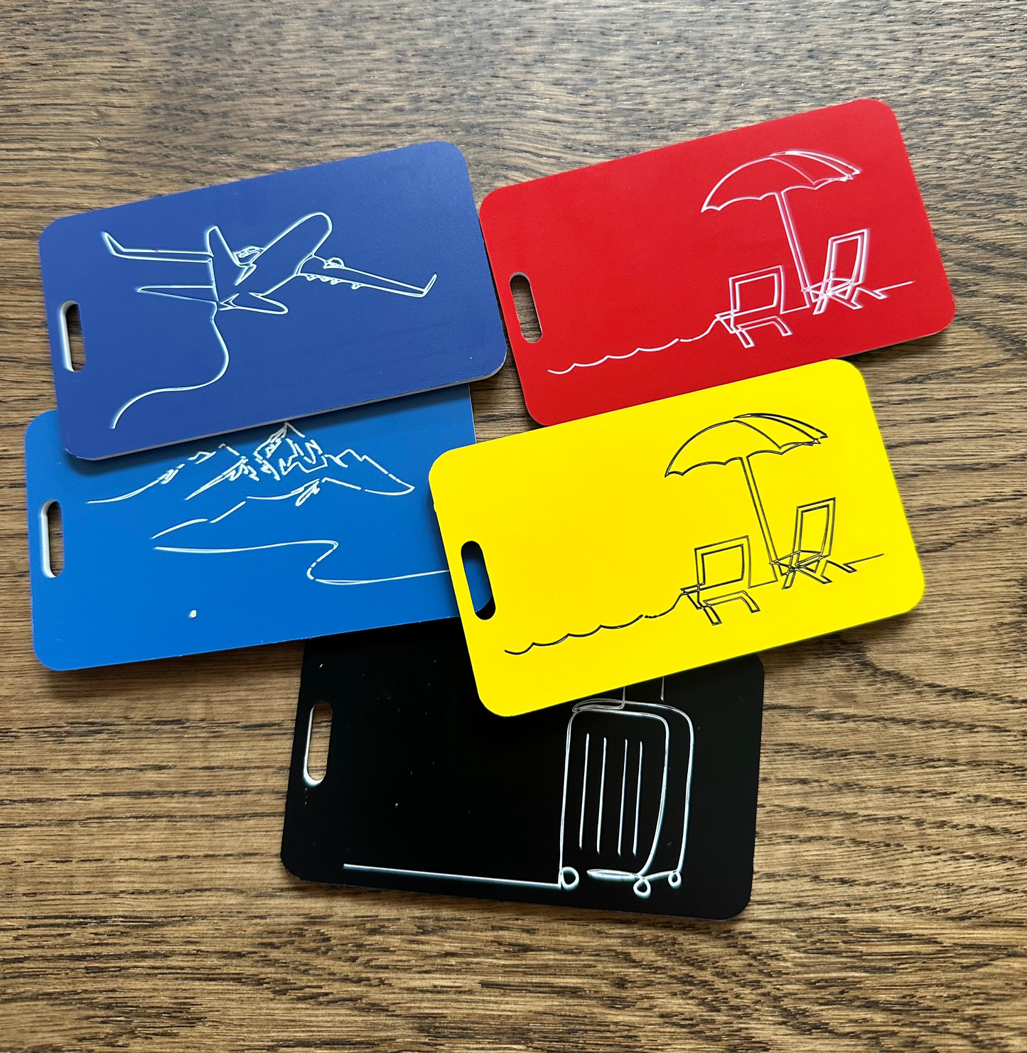 Luggage tags in different colors showcasing serenity luggage tag in red and yellow.