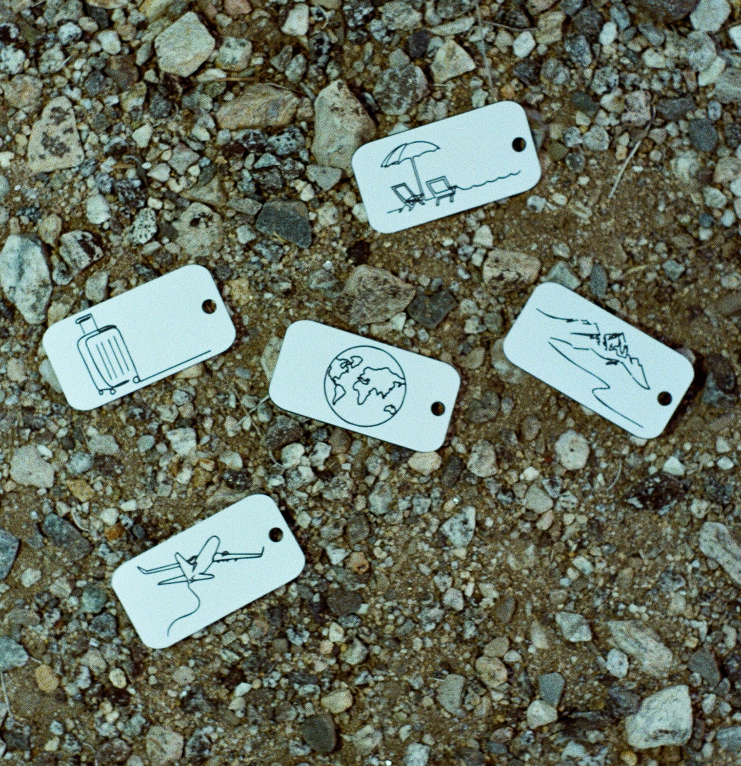 Film photo of keychains in white with serenity key tag.