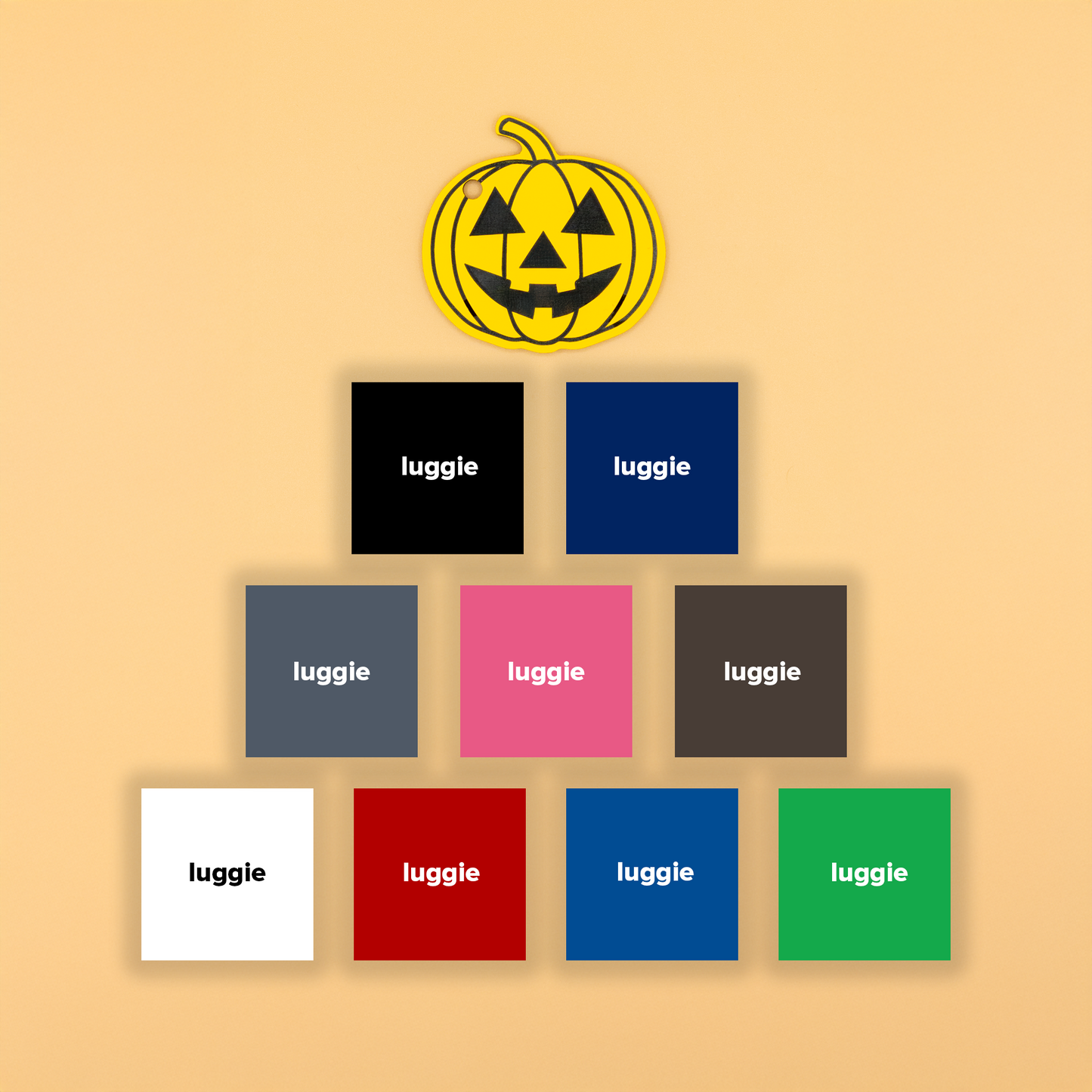 Yellow fall-themed pumpkin keychain with various color options on a beige background.