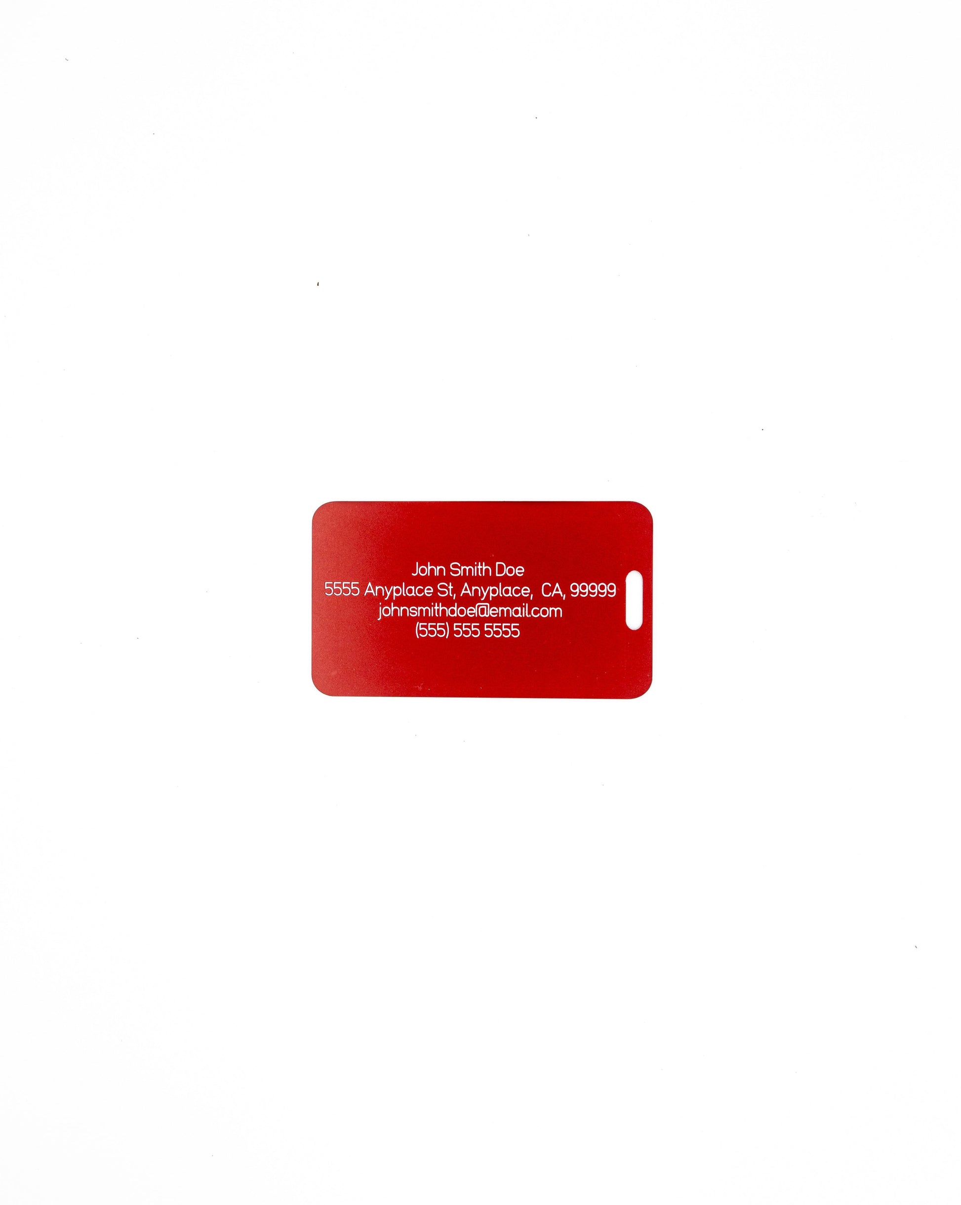 Luggage Design acrylic luggage tag in red with travel information on rear.
