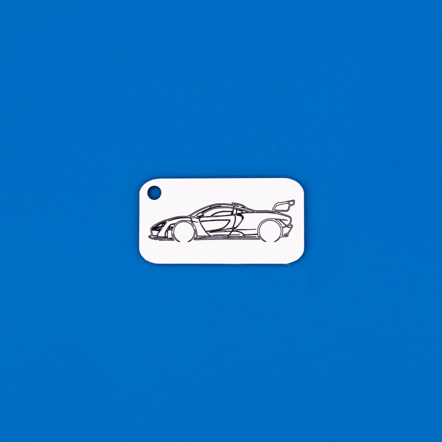 McLaren Senna Acrylic Keychain in white with just the hole.