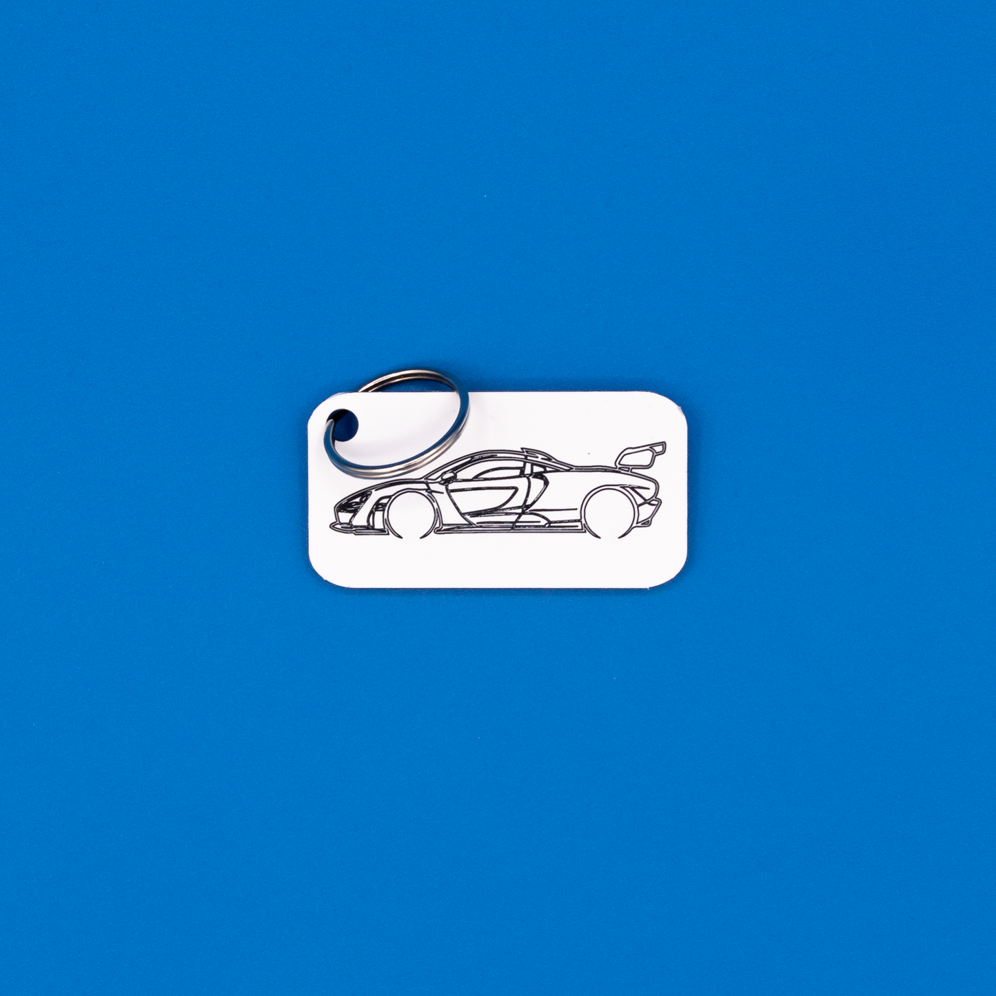 McLaren Senna Acrylic Keychain in white with classic key ring.