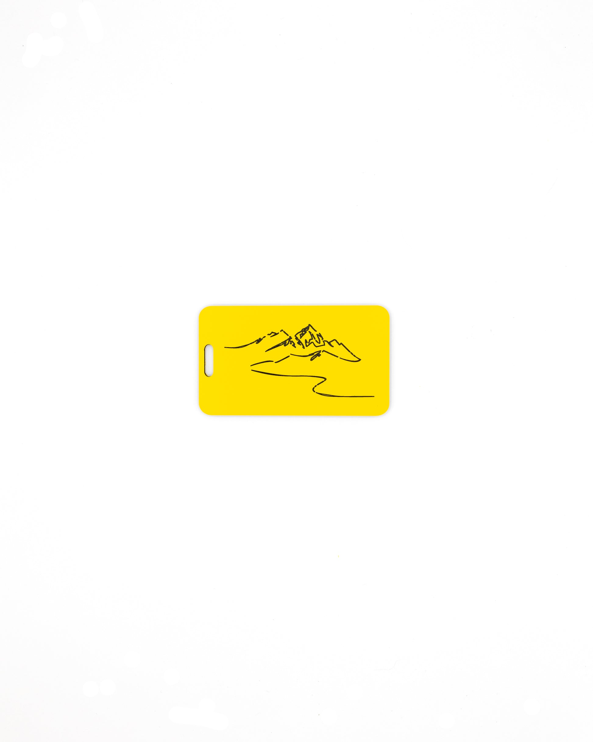 Mountain Design acrylic luggage tag in yellow.
