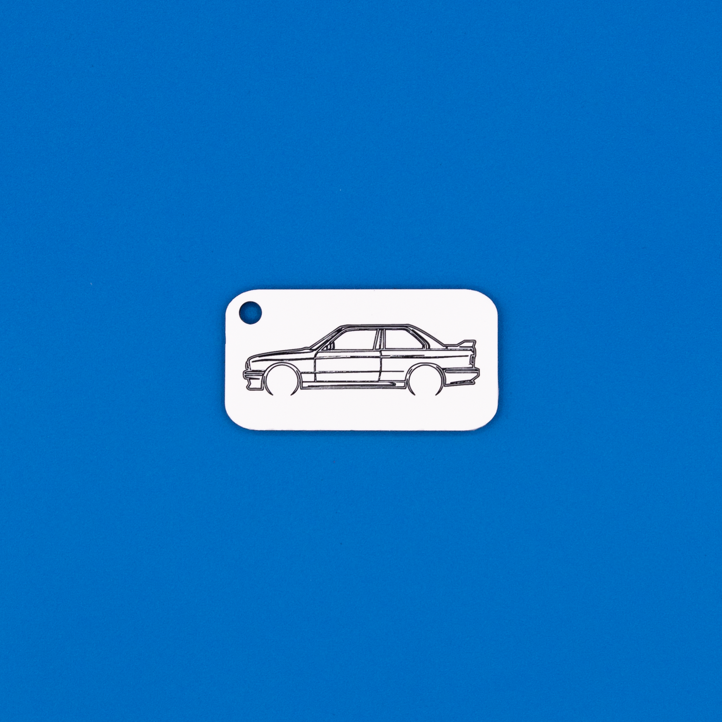 BMW E30 M3 Acrylic Keychain in white with just the hole.