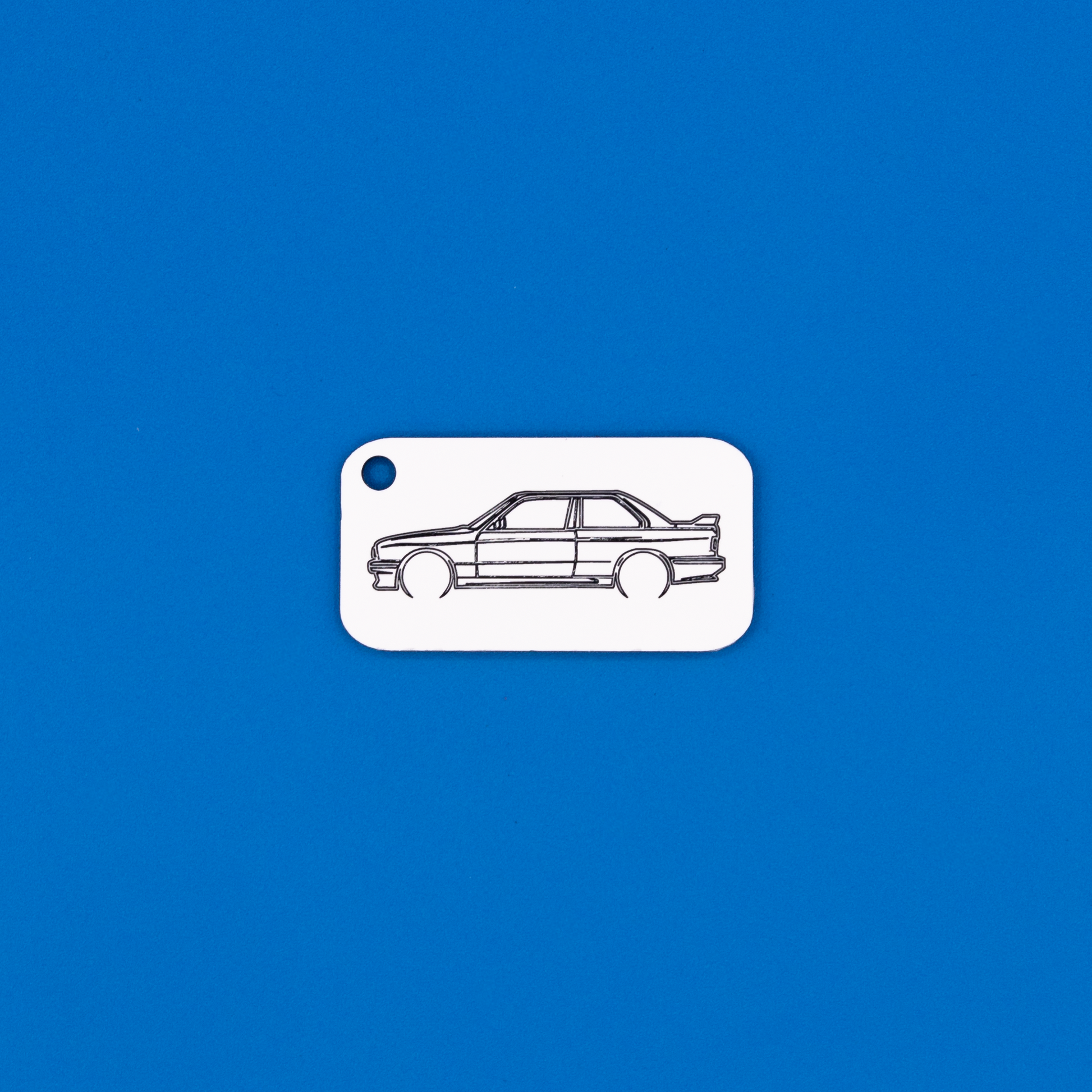 BMW E30 M3 Acrylic Keychain in white with just the hole.