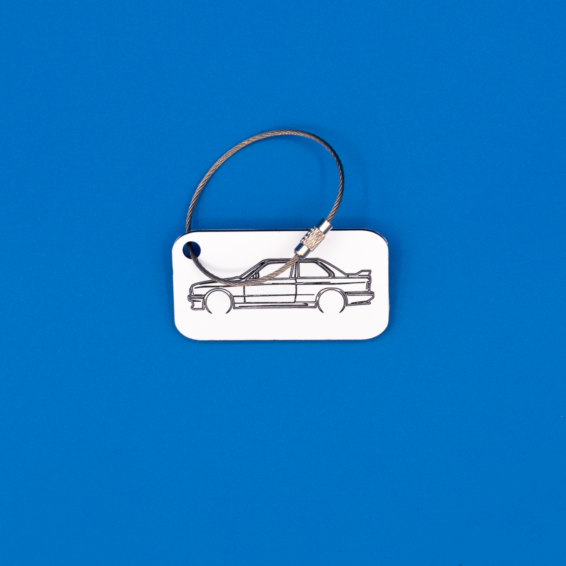 BMW E30 M3 Acrylic Keychain in white with a wire loop.