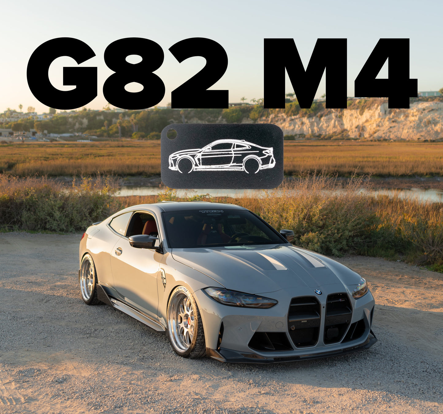 Picture of G82 M4 Acrylic Keychain in black with G82 M4 in background.