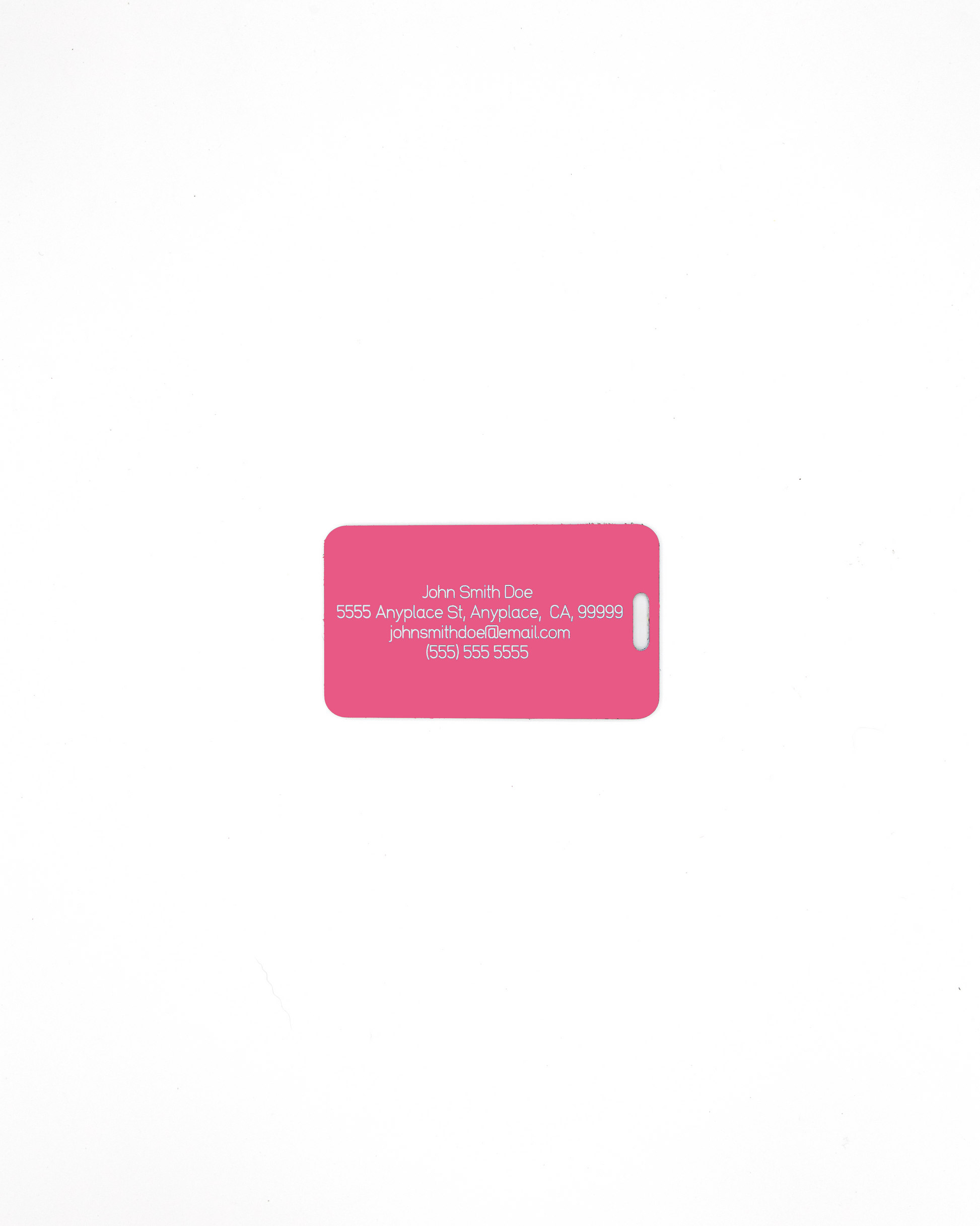 Acrylic luggage tag with information on rear in pink.