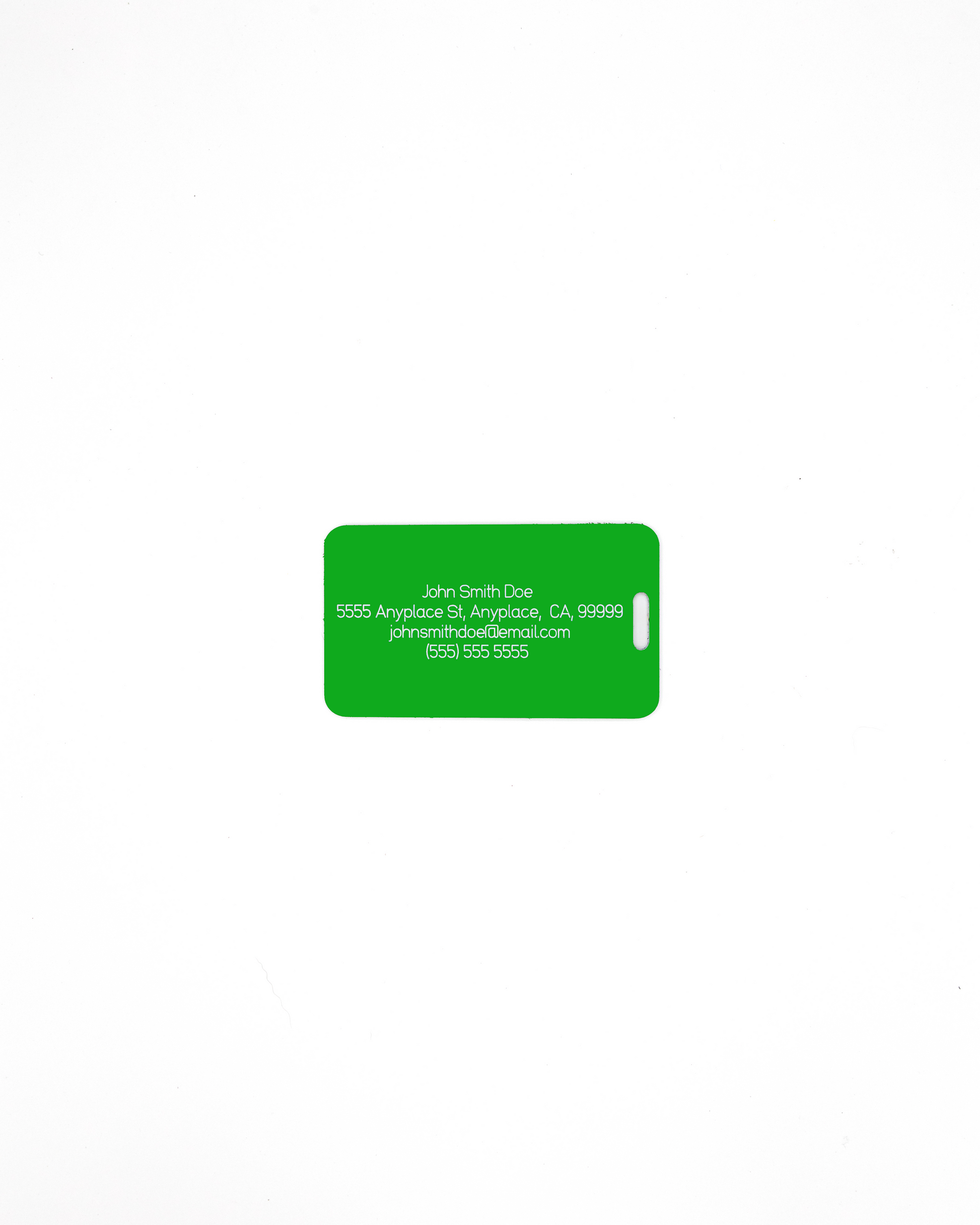 Acrylic luggage tag in spring green with information on rear.