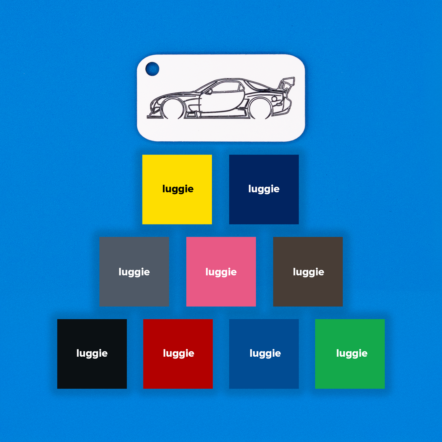 Mazda FD RX7 Acrylic Keychain in white with just the hole showcasing all other nine color options: yellow, dark blue, grey, pink, chocolate, light blue, red, black and spring green.