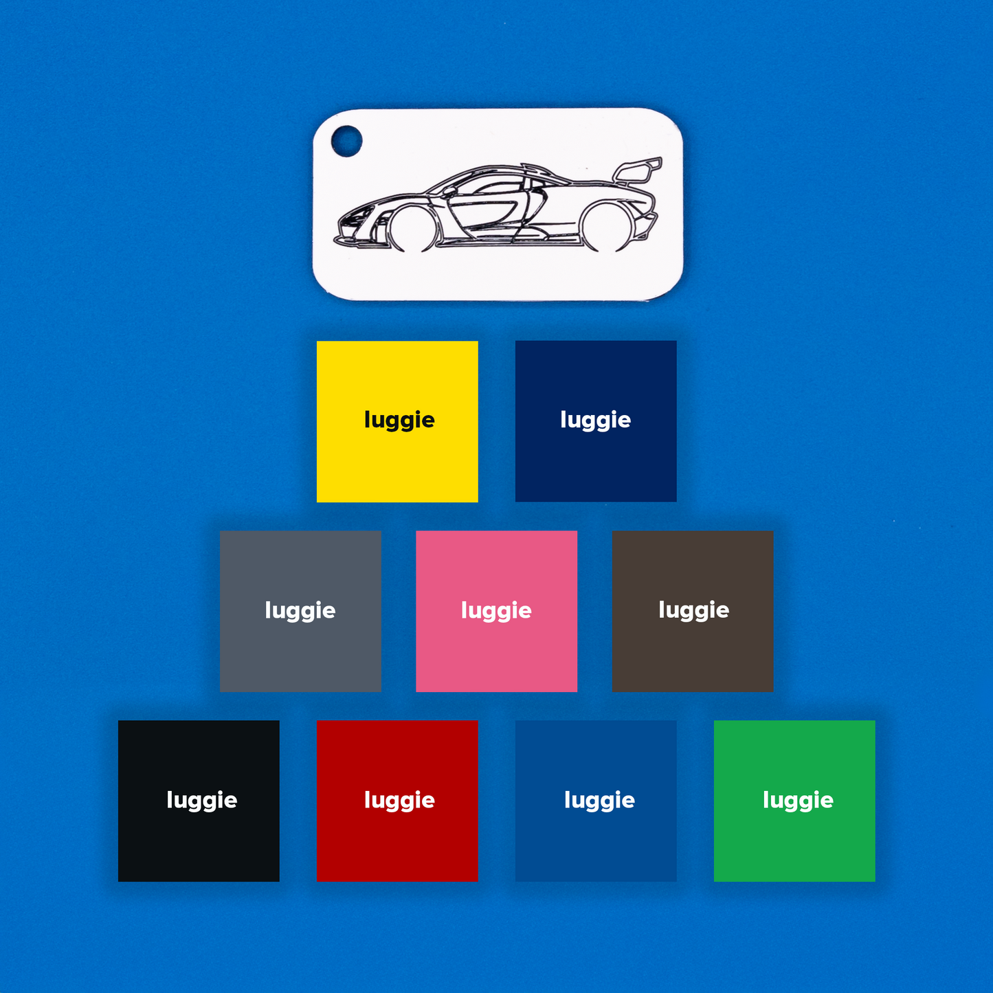 McLaren Senna Acrylic Keychain in white with just the hole showcasing nine other color options: yellow, dark blue, grey, pink, chocolate, light blue, red, black and spring green.