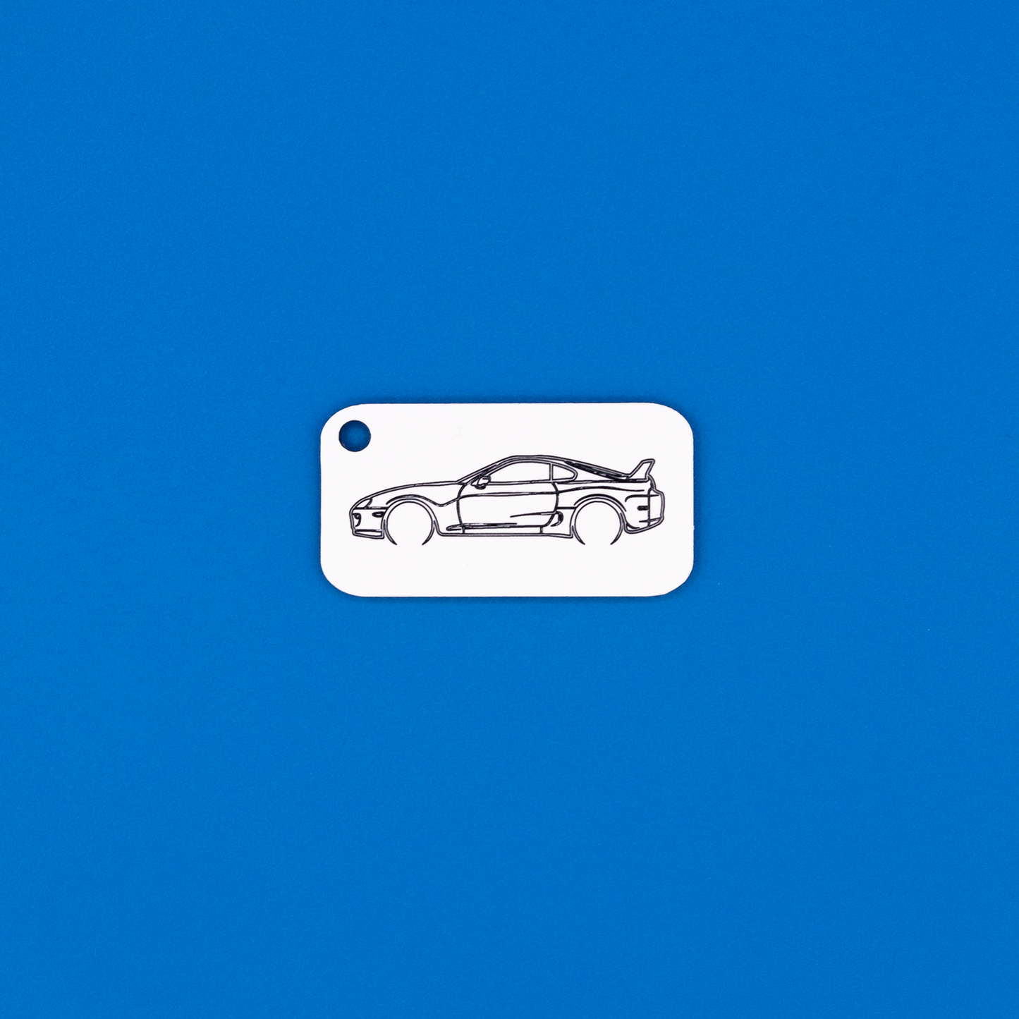 Toyota Supra Acrylic Keychain in white with just the hole.