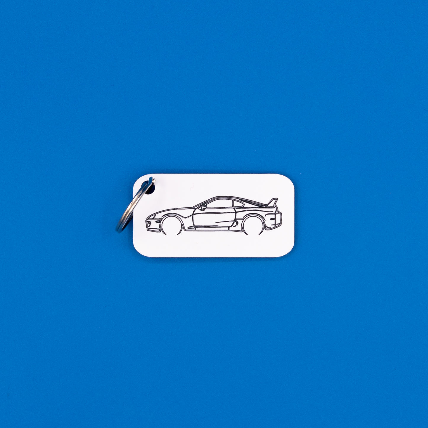 Toyota Supra Acrylic Keychain in white with a classic key ring.