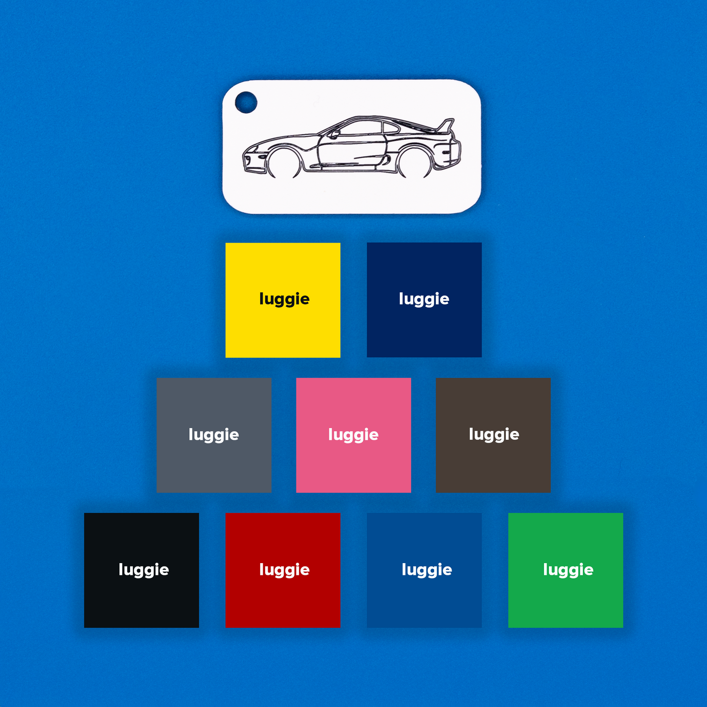 Toyota Supra Acrylic Keychain in white with just the hole showcasing nine other color options: yellow, dark blue, grey, pink, chocolate, light blue, red, black and spring green.