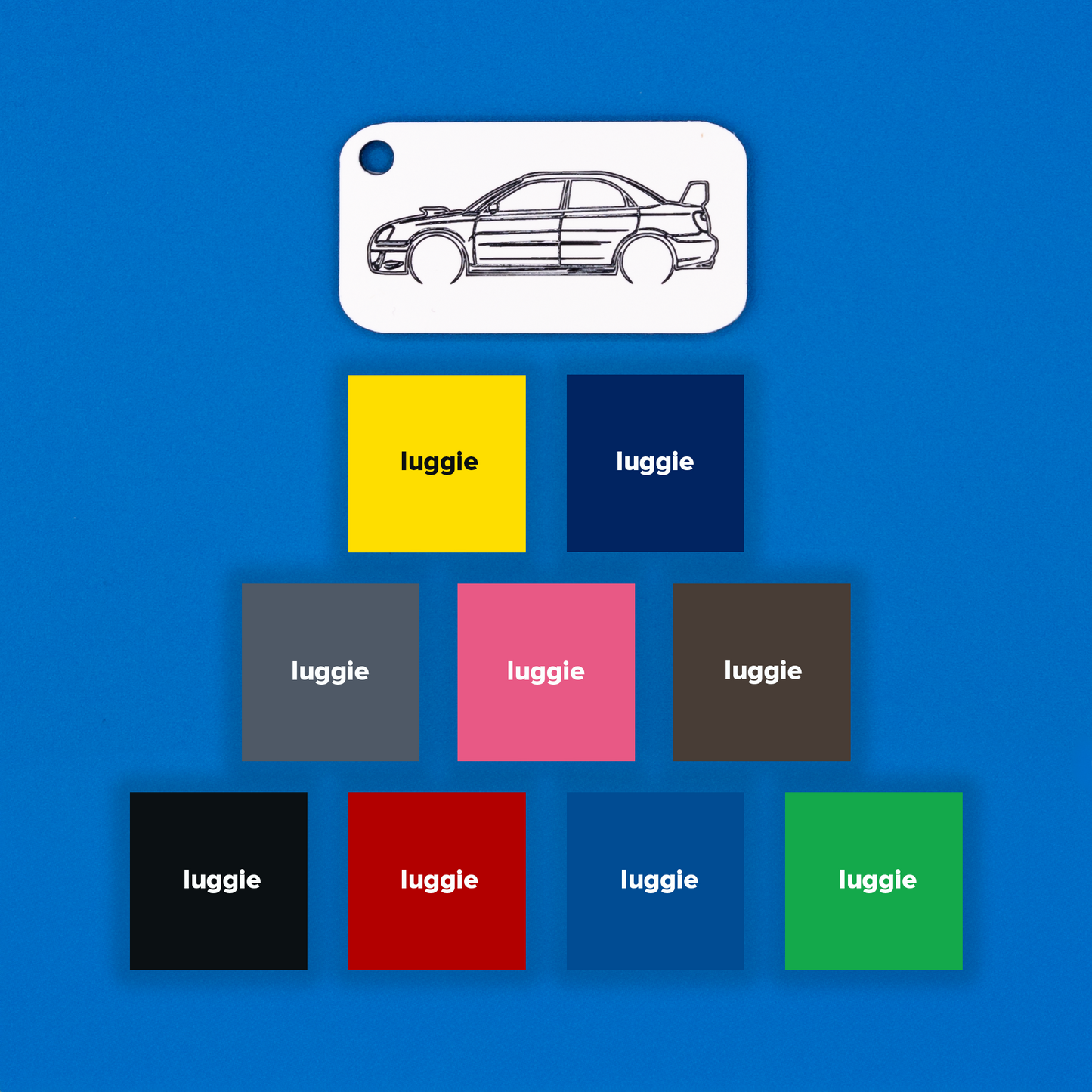 Subaru WRX STi Acrylic Keychain in white with just the hole showcasing nine color options: yellow, dark blue, grey, pink, chocolate, light blue, red, black and spring green.