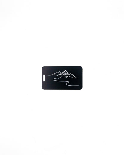 Mountain Design acrylic luggage tag in black.