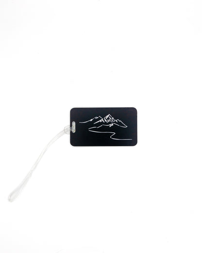 Mountain Design acrylic luggage tag in black with worm loop.