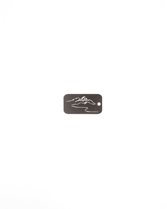 key tag with mountain design travel accessory chocolate