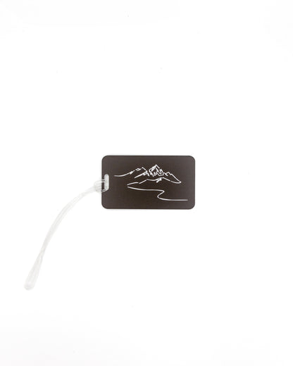 Mountain Design acrylic luggage tag in chocolate with worm loop.
