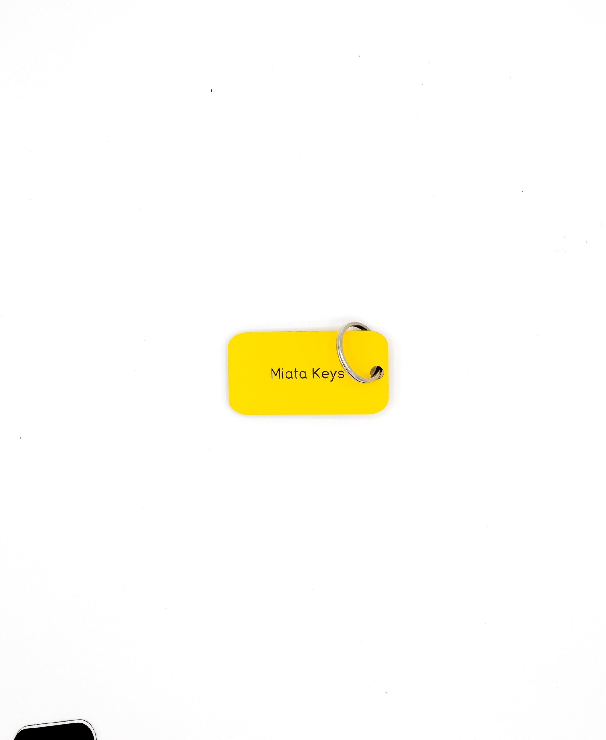 yellow custom key tag with text