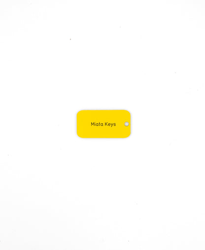 yellow custom key tag with text