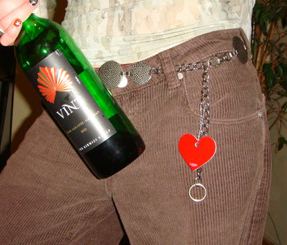 Picture of Heart Design Acrylic Keychain in red attached to chain on pants. 