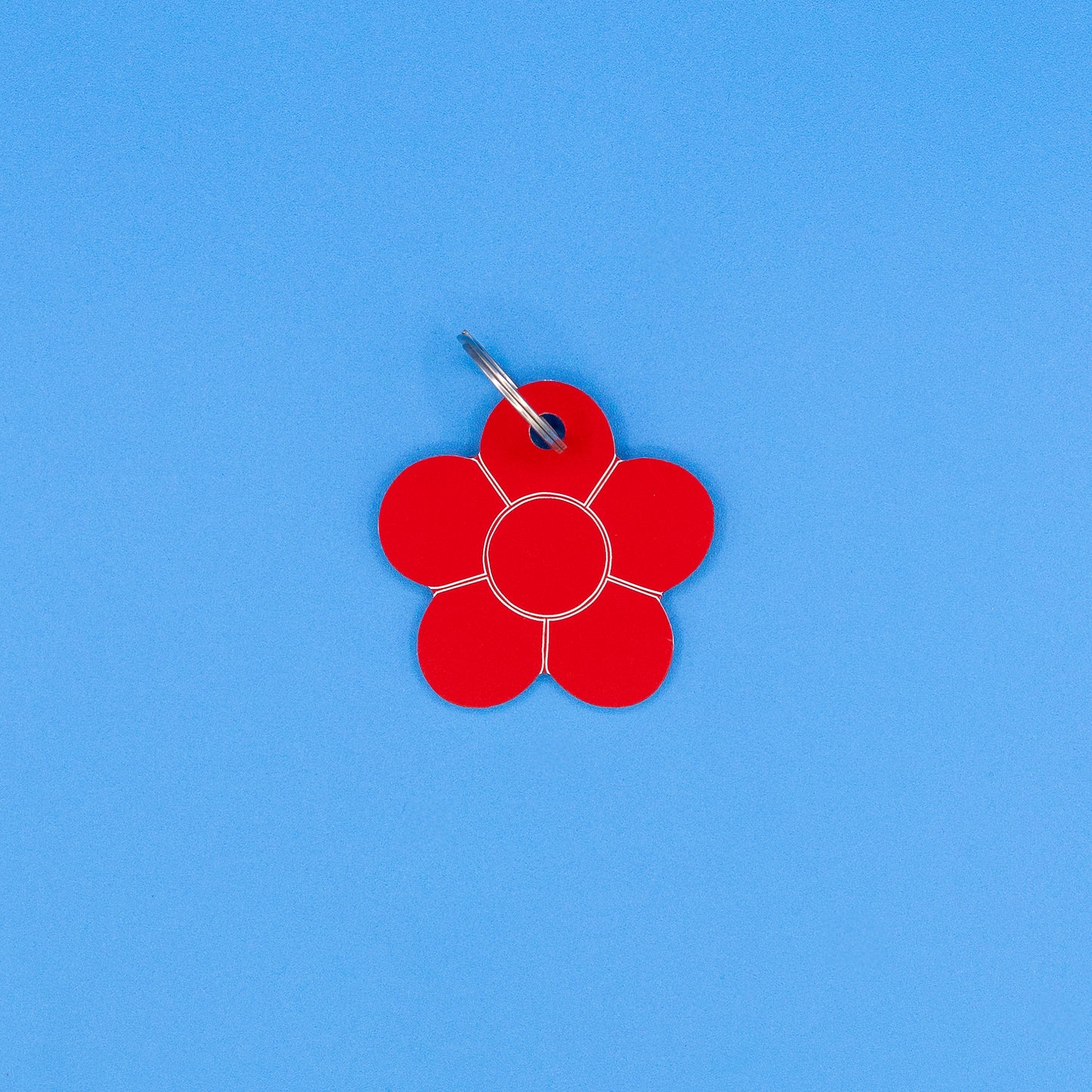 Red flower-shaped tag on a blue background