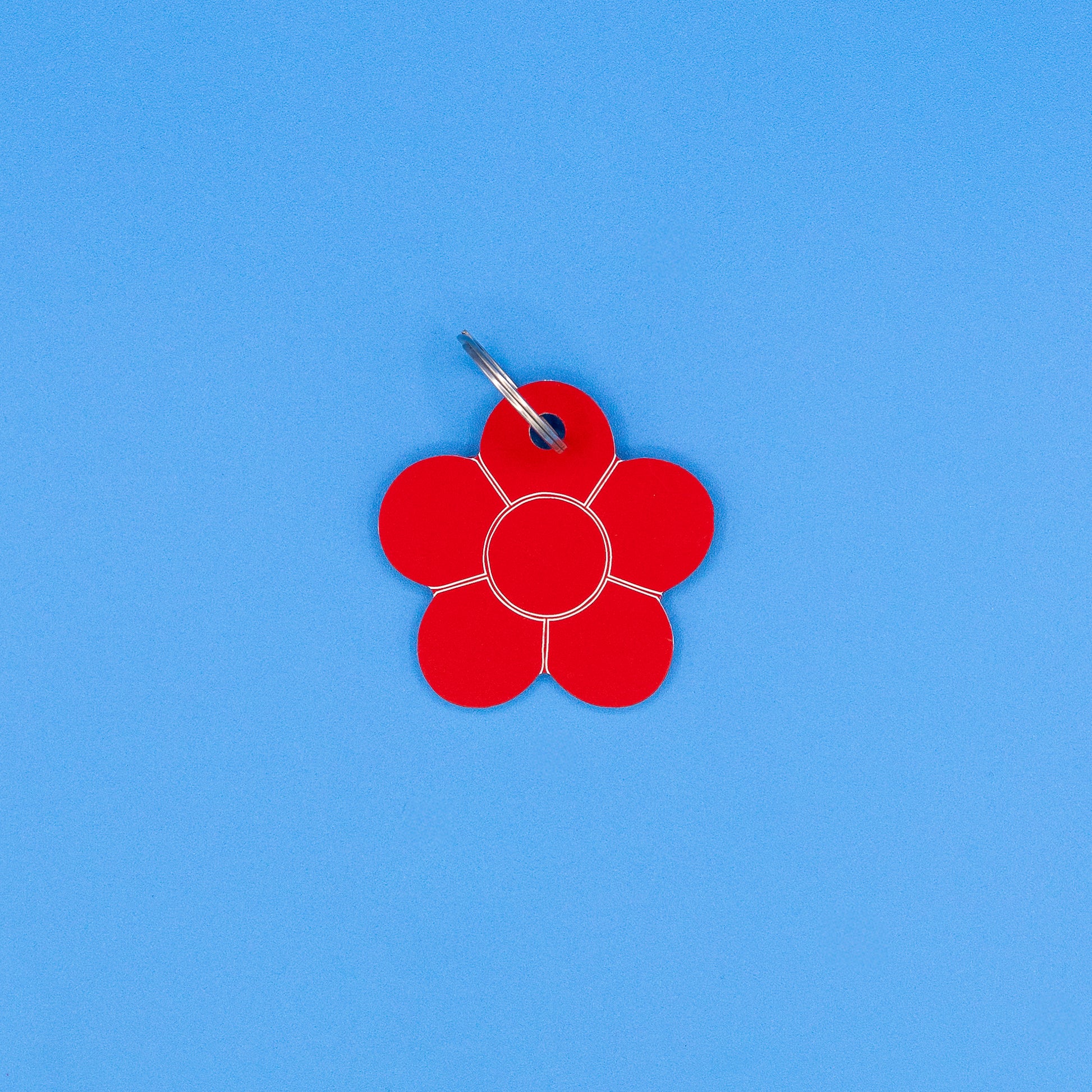 Red flower-shaped tag on a blue background