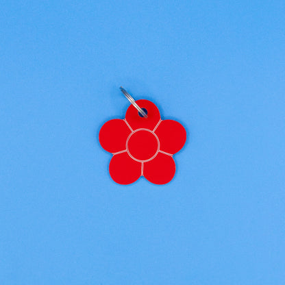 Red flower-shaped tag on a blue background