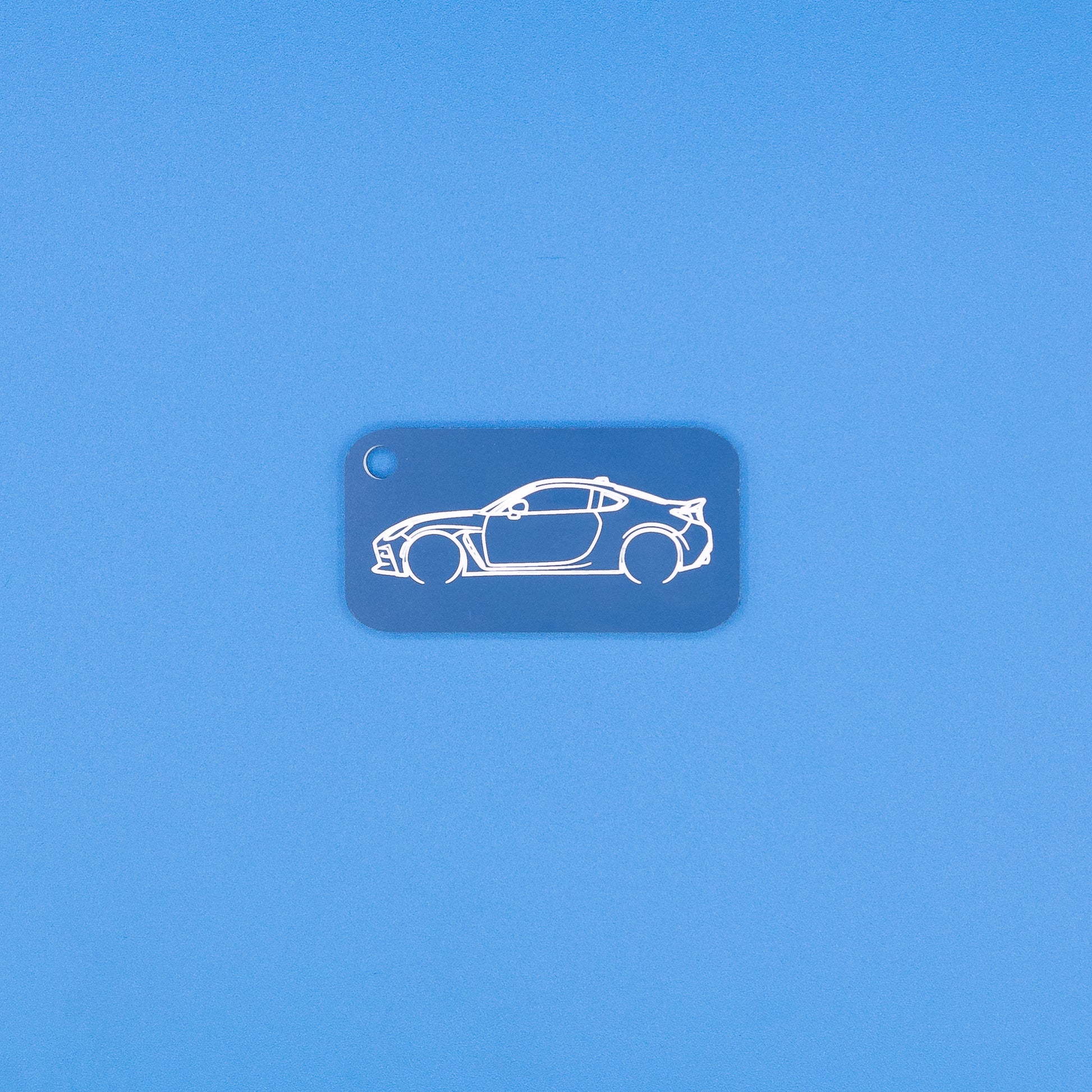 Toyota GR86 Keychain in Light blue on blue background