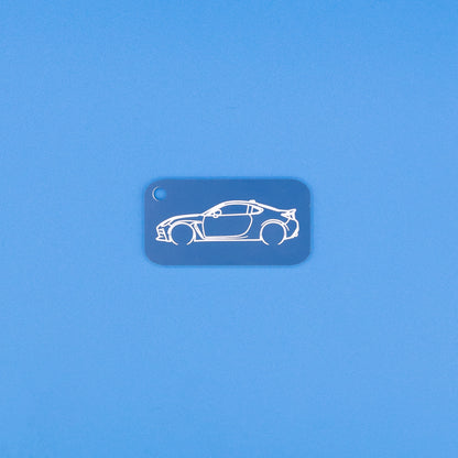 Toyota GR86 Keychain in Light blue on blue background