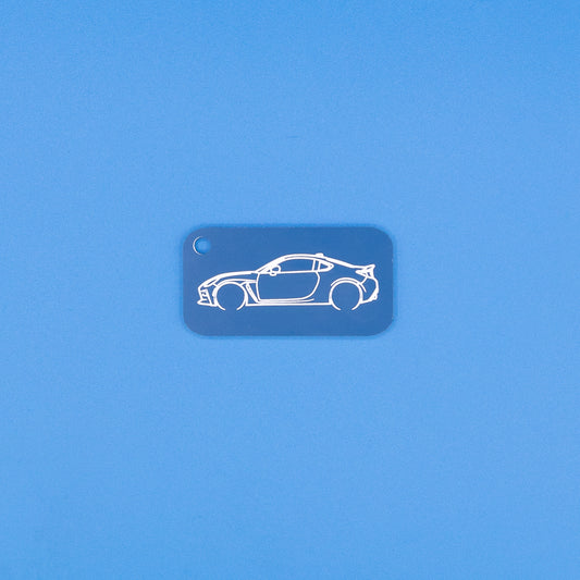 Toyota GR86 Keychain in Light blue on blue background