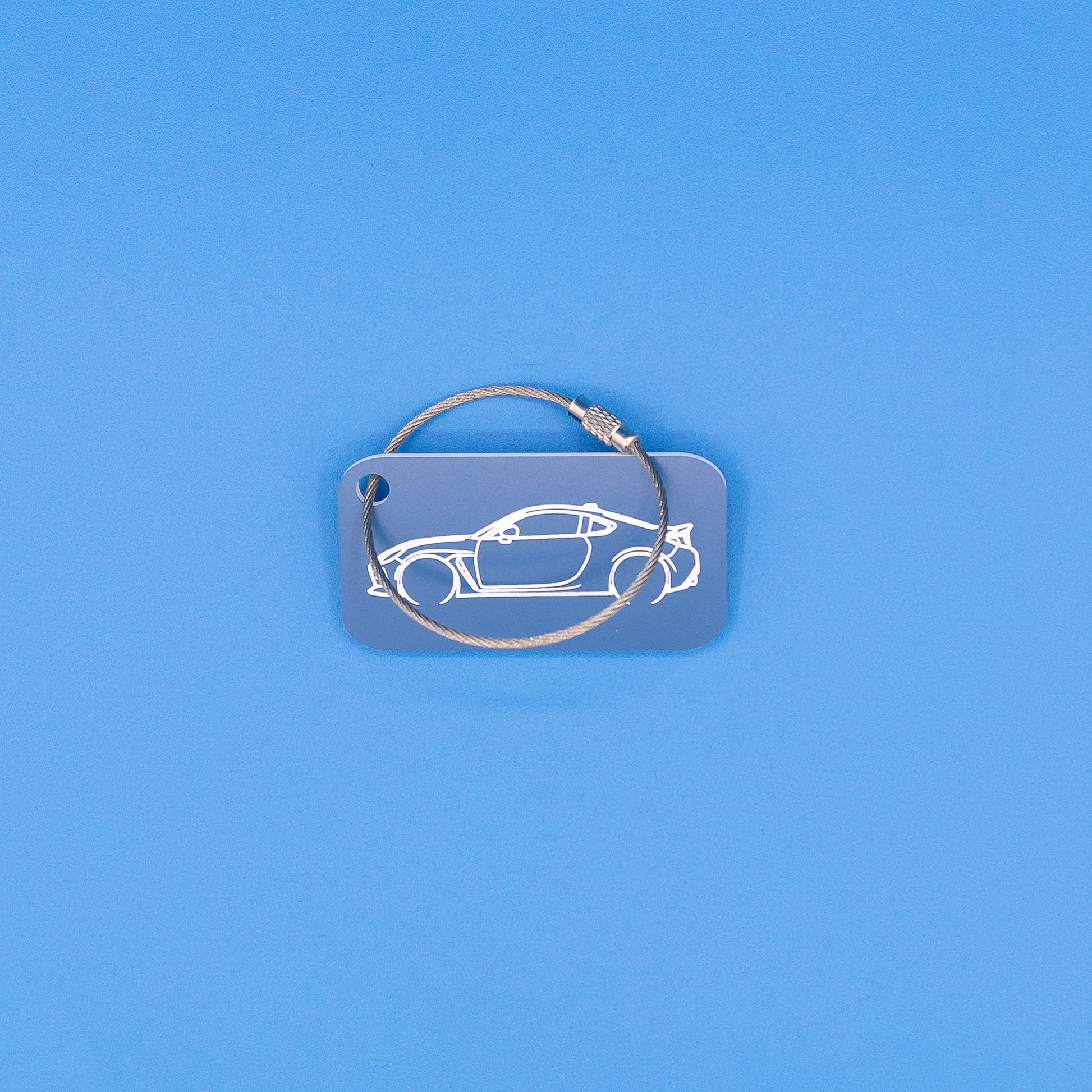 Toyota GR86 Keychain with wire loop on blue background