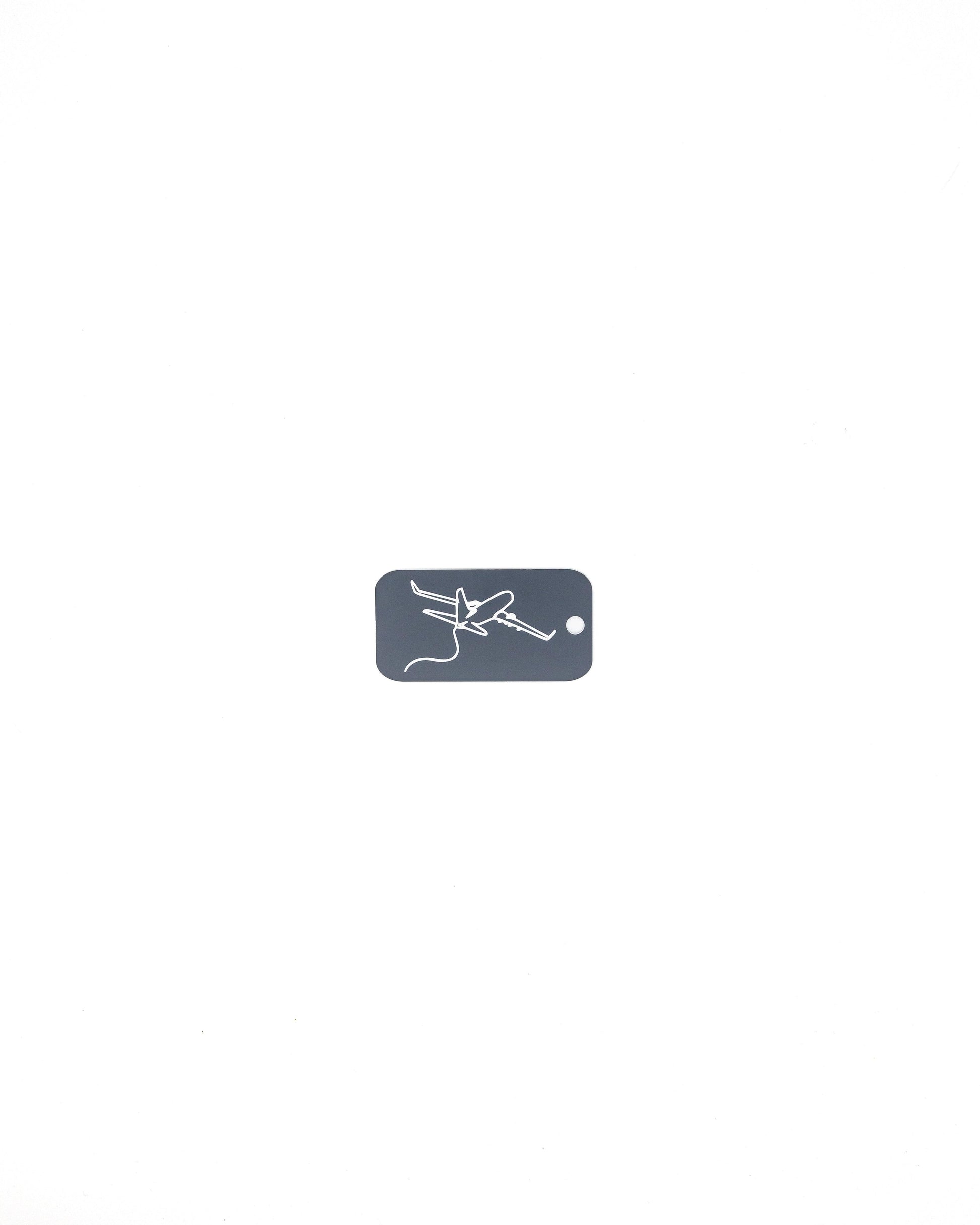 key tag with airplane design travel accessory grey