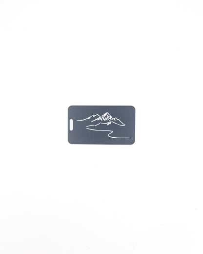 Mountain Design acrylic luggage tag in grey.