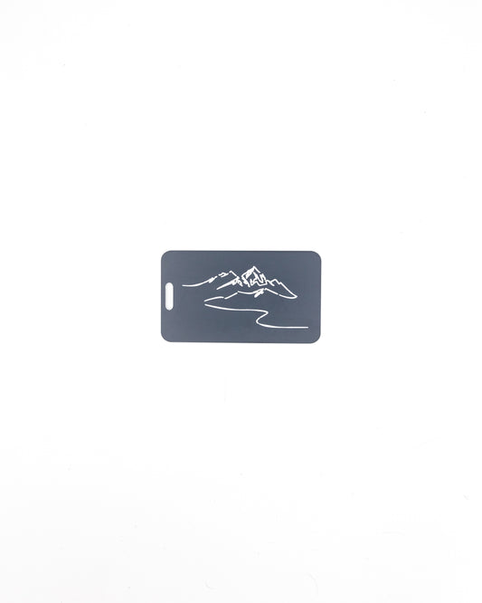 Mountain Design acrylic luggage tag in grey.