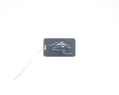 Mountain Design acrylic luggage tag in grey with worm loop.