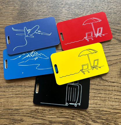 Luggage tags in different colors showcasing serenity luggage tag in red and yellow. 
