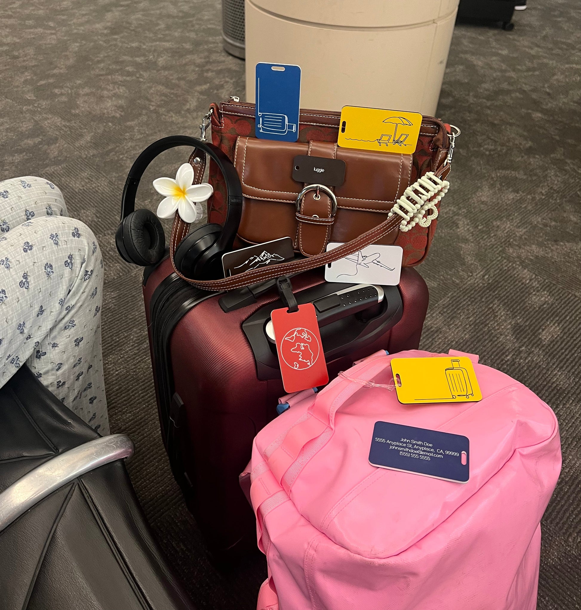 Luggage Tags attached to suitcases. 