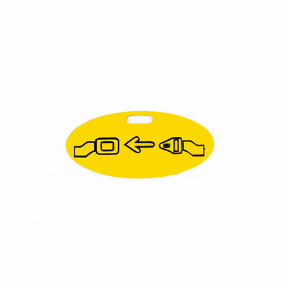 Yellow seatbelt sign luggage tag on a white background