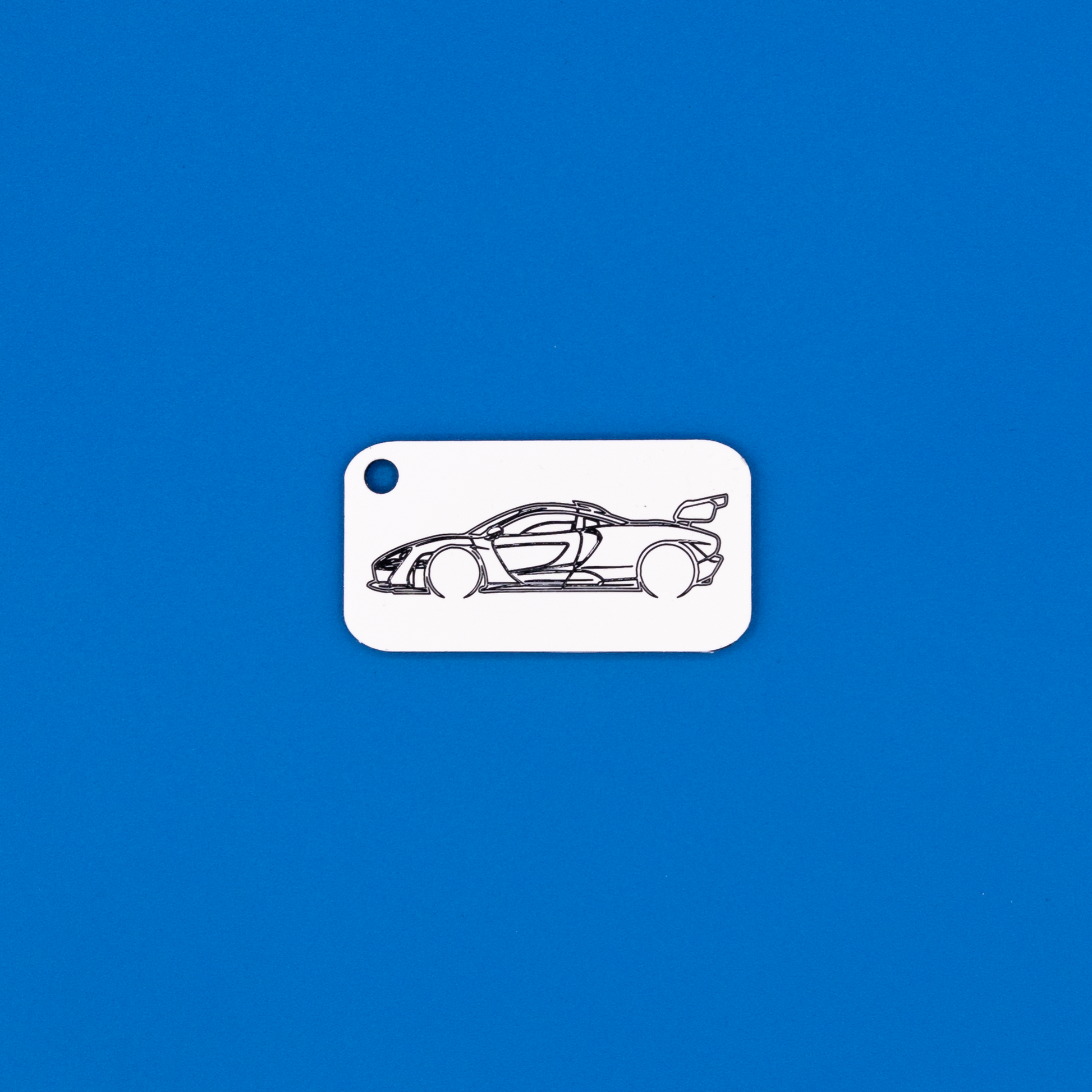 McLaren Senna Acrylic Keychain in white with just the hole. 