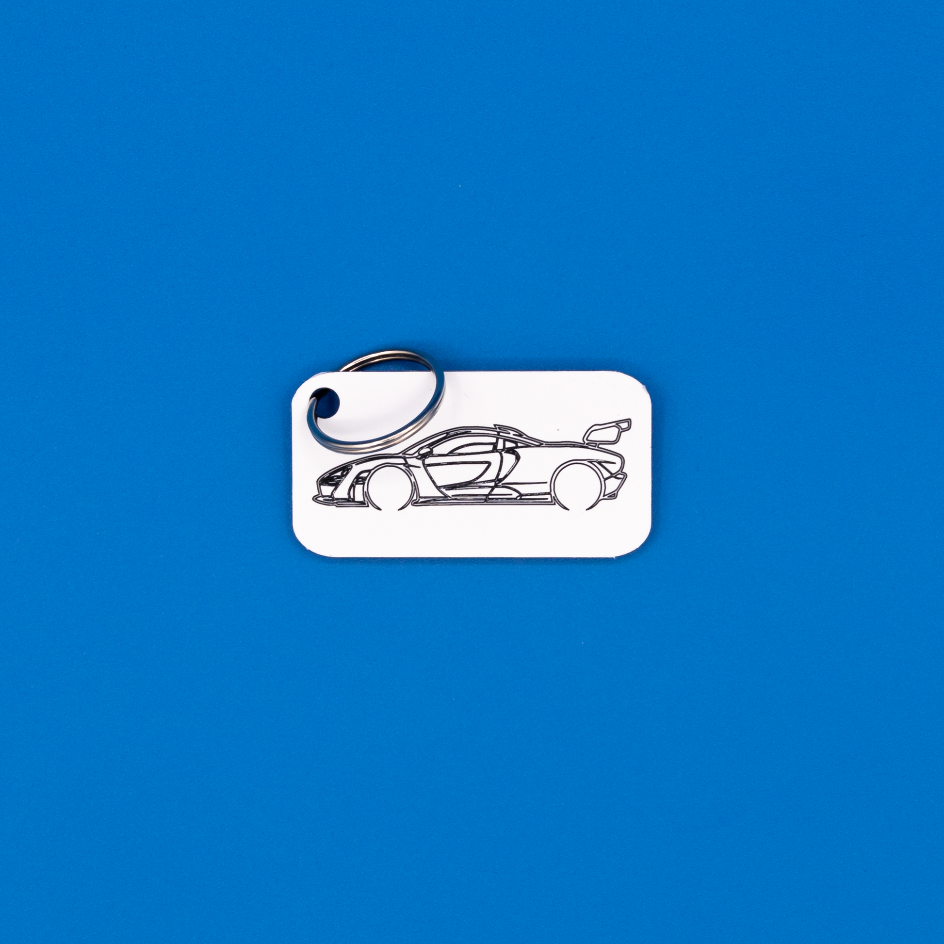 McLaren Senna Acrylic Keychain in white with classic key ring. 