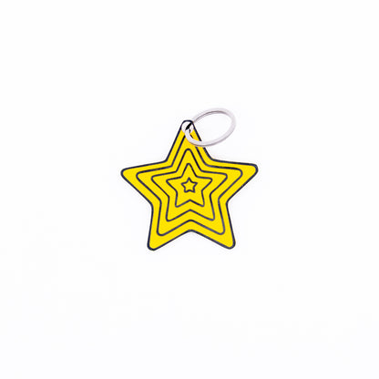 Yellow star-shaped keychain with key ring on a white background